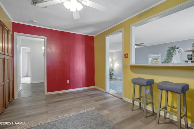 101 Sherry St, Baldwin, LA 70514 - dining space featuring ceiling fan, wood finished floors, and ornamental molding