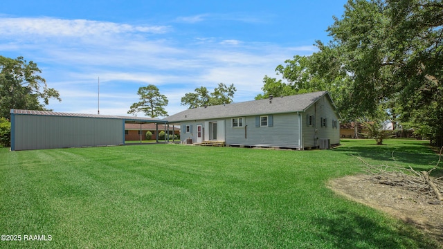 101 Sherry St, Baldwin, LA 70514 - back of house with a lawn, entry steps, and an outbuilding