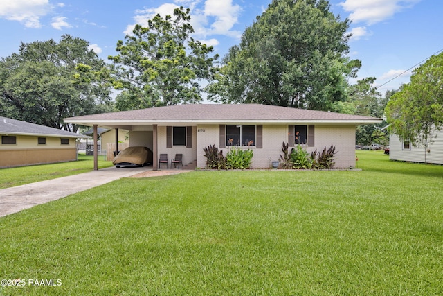 522 Caroline St, New Iberia, LA 70560 - view of front of house with concrete driveway, brick siding, and a front lawn