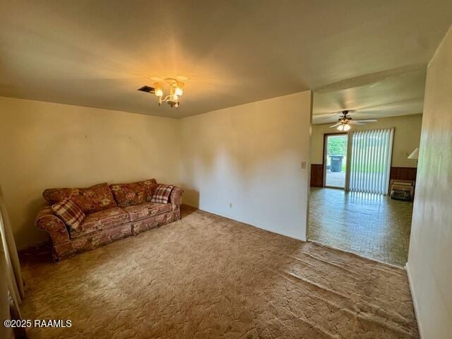 110 W Tampico St, New Iberia, LA 70563 - unfurnished living room with carpet floors, a chandelier, and a ceiling fan