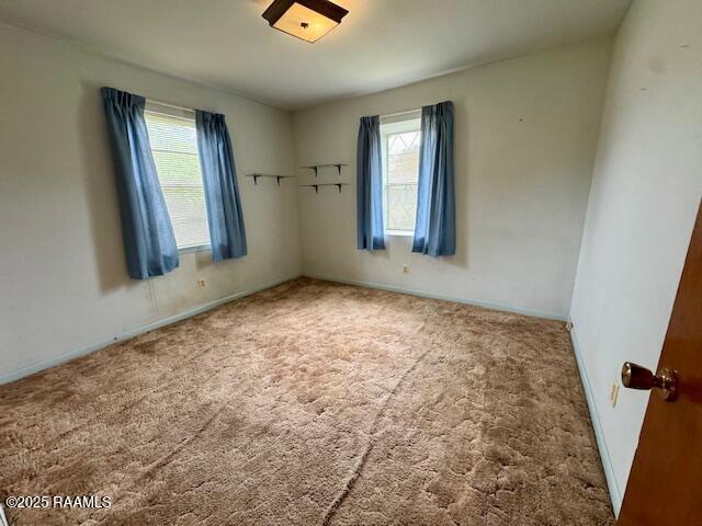 110 W Tampico St, New Iberia, LA 70563 - carpeted spare room featuring plenty of natural light