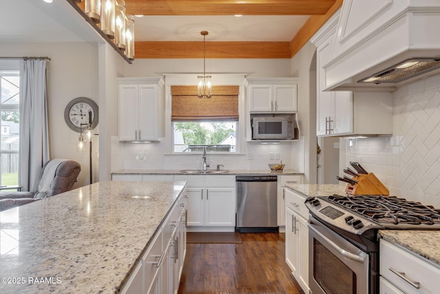 203 Whispering Meadows Rd, Broussard, LA 70518 - kitchen featuring stainless steel appliances, custom exhaust hood, decorative backsplash, and white cabinetry