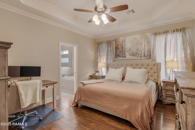 203 Whispering Meadows Rd, Broussard, LA 70518 - bedroom with a tray ceiling, hardwood / wood-style flooring, crown molding, and ensuite bath