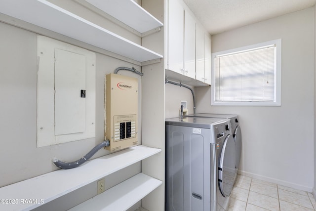 13723 Lynnedale Loop, Abbeville, LA 70510 - washroom with washer and dryer, electric panel, cabinet space, and light tile patterned floors