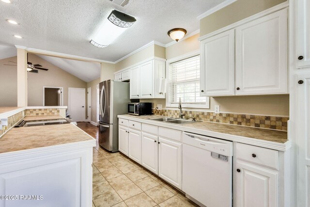 13723 Lynnedale Loop, Abbeville, LA 70510 - kitchen with stainless steel appliances, white cabinetry, a textured ceiling, crown molding, and a ceiling fan
