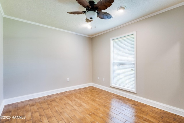 13723 Lynnedale Loop, Abbeville, LA 70510 - empty room with wood finished floors, a ceiling fan, a textured ceiling, and crown molding