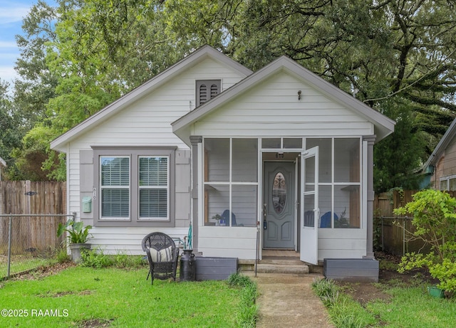 610 Ashton St, New Iberia, LA 70563 - bungalow-style house with entry steps and a sunroom