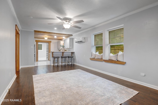 610 Ashton St, New Iberia, LA 70563 - living room with a wall unit AC, a ceiling fan, dark wood-type flooring, ornamental molding, and healthy amount of natural light