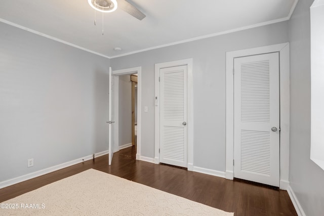 610 Ashton St, New Iberia, LA 70563 - unfurnished bedroom with dark wood finished floors, crown molding, and a ceiling fan
