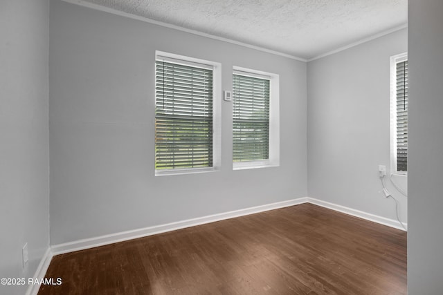 610 Ashton St, New Iberia, LA 70563 - spare room with dark wood-style floors, a textured ceiling, and crown molding