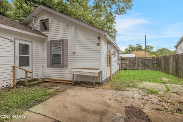 610 Ashton St, New Iberia, LA 70563 - back of house featuring a patio area, a gate, and entry steps