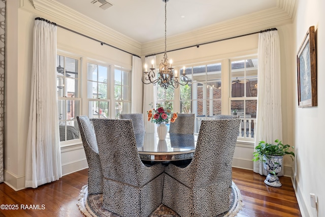 232 Princeton Woods Loop, Lafayette, LA 70508 - dining room featuring a chandelier, crown molding, and dark wood finished floors