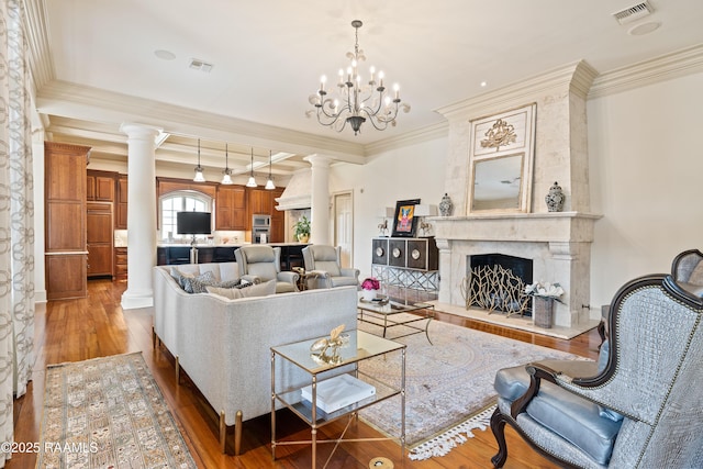 232 Princeton Woods Loop, Lafayette, LA 70508 - living area with decorative columns, wood finished floors, ornamental molding, a high end fireplace, and beamed ceiling