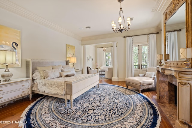 232 Princeton Woods Loop, Lafayette, LA 70508 - bedroom with a chandelier, wood-type flooring, crown molding, and a fireplace