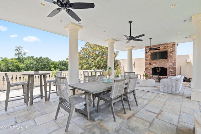 232 Princeton Woods Loop, Lafayette, LA 70508 - view of patio with an outdoor brick fireplace, outdoor dining space, and ceiling fan