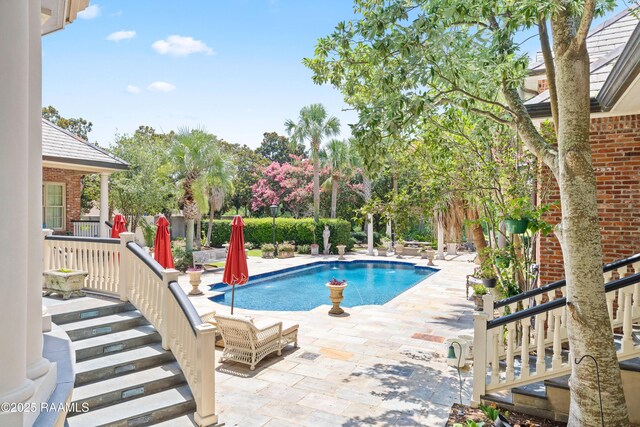 232 Princeton Woods Loop, Lafayette, LA 70508 - view of swimming pool with a patio area