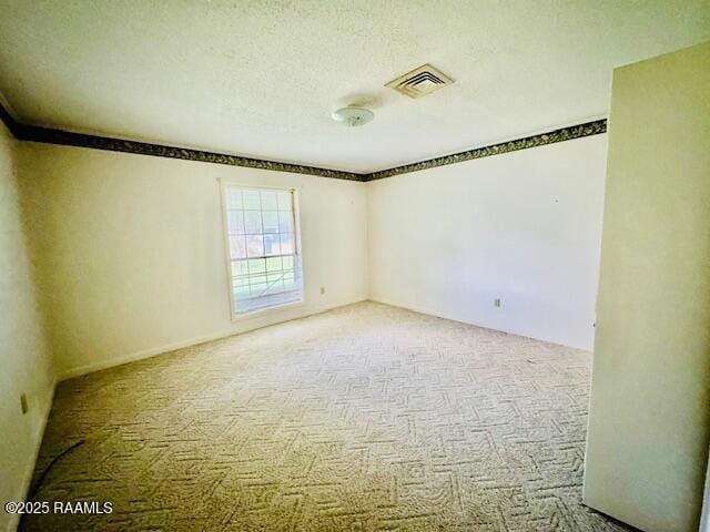 122 Progress Rd, Ville Platte, LA 70586 - spare room with carpet and a textured ceiling