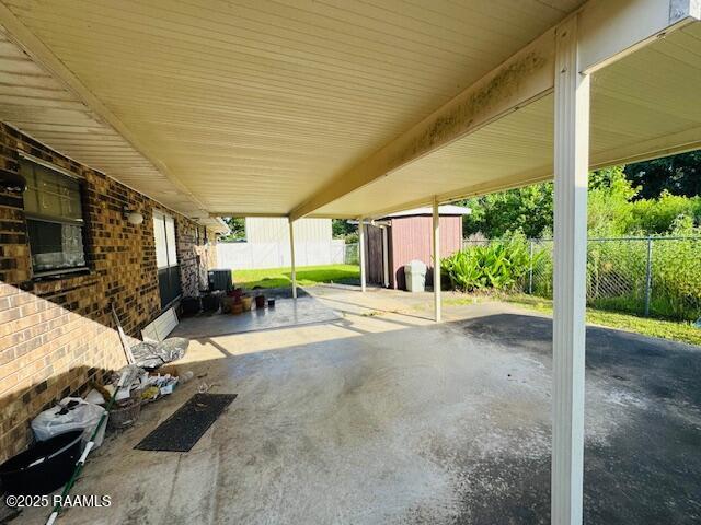 122 Progress Rd, Ville Platte, LA 70586 - fenced backyard with a shed and a patio area