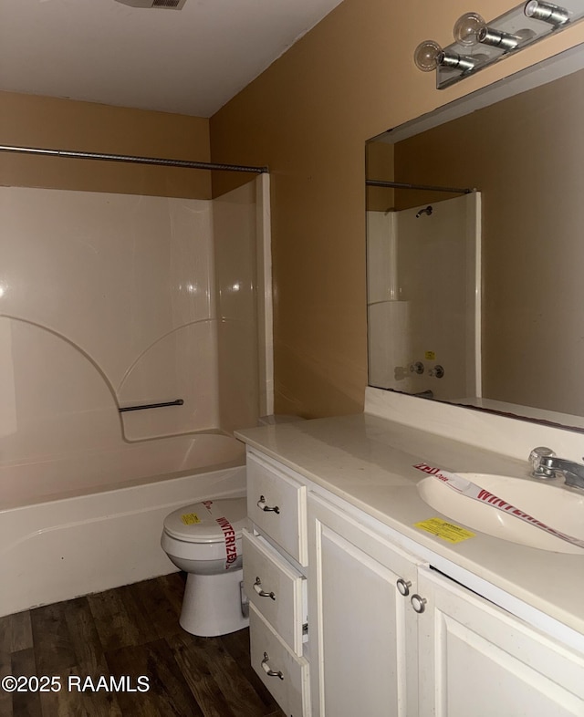 14927 S Guegnon St, Abbeville, LA 70510 - bathroom with vanity, wood finished floors, and shower / bathtub combination