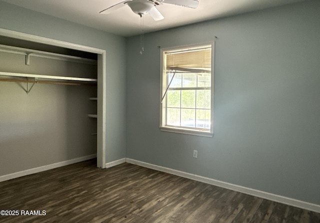 14927 S Guegnon St, Abbeville, LA 70510 - unfurnished bedroom with dark wood-style floors, a closet, and a ceiling fan