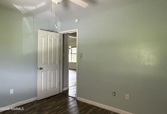 14927 S Guegnon St, Abbeville, LA 70510 - empty room featuring a ceiling fan, dark wood finished floors, and a smoke detector