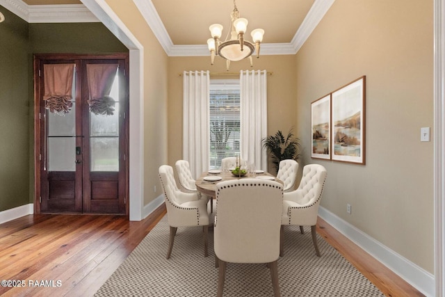 100 Carrollton Cir, Lafayette, LA 70503 - dining area with light wood-style flooring, crown molding, a chandelier, and french doors