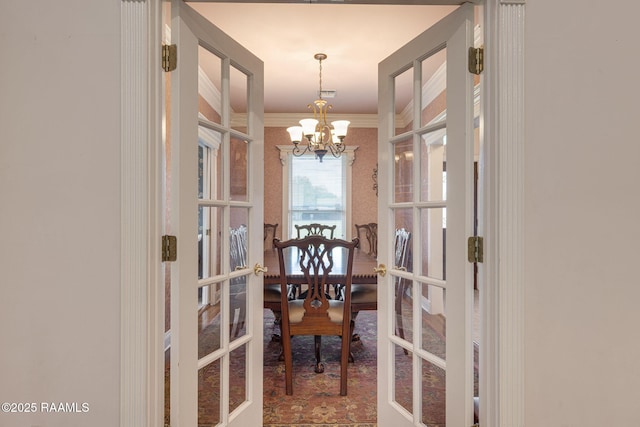 104 Briarfield Dr, Carencro, LA 70520 - dining space featuring a chandelier, french doors, and ornamental molding