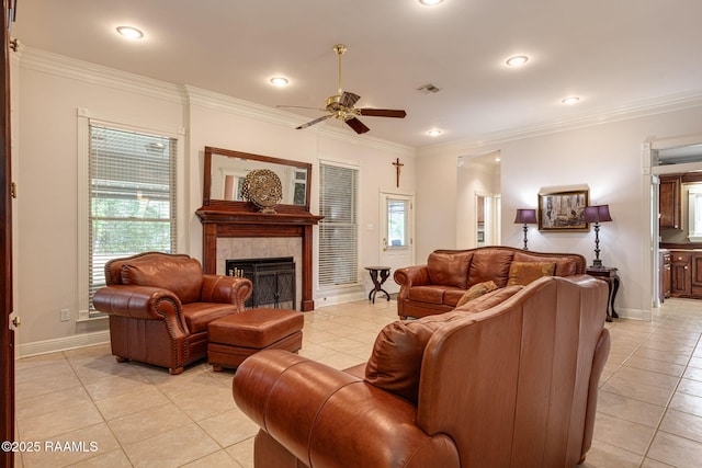104 Briarfield Dr, Carencro, LA 70520 - living room with light tile patterned floors, a ceiling fan, a fireplace, recessed lighting, and crown molding