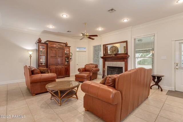 104 Briarfield Dr, Carencro, LA 70520 - living area featuring light tile patterned floors, a fireplace, ornamental molding, a ceiling fan, and recessed lighting