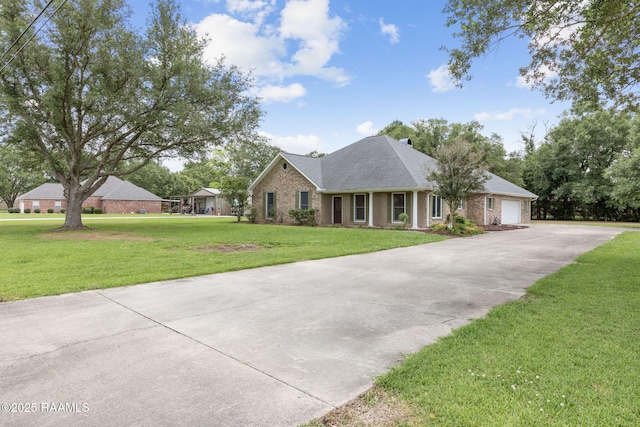 104 Briarfield Dr, Carencro, LA 70520 - view of front of property featuring a front lawn, a garage, brick siding, and driveway