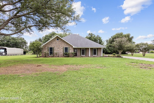 104 Briarfield Dr, Carencro, LA 70520 - ranch-style house with a front yard, a shingled roof, and brick siding