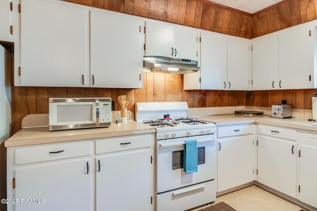 107 Julenie Way, Youngsville, LA 70592 - kitchen with under cabinet range hood, gas range gas stove, light countertops, and white cabinetry