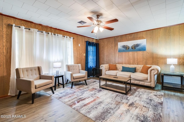 107 Julenie Way, Youngsville, LA 70592 - living room featuring wood finished floors, ceiling fan, and wooden walls