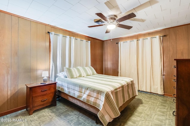 107 Julenie Way, Youngsville, LA 70592 - bedroom with wooden walls and a ceiling fan
