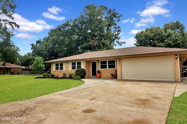 177 Radcliffe Dr, Lafayette, LA 70501 - view of front of home featuring concrete driveway, a garage, and a front yard