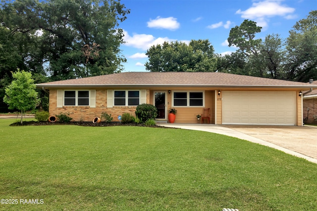 177 Radcliffe Dr, Lafayette, LA 70501 - ranch-style house with an attached garage, driveway, a front lawn, and brick siding