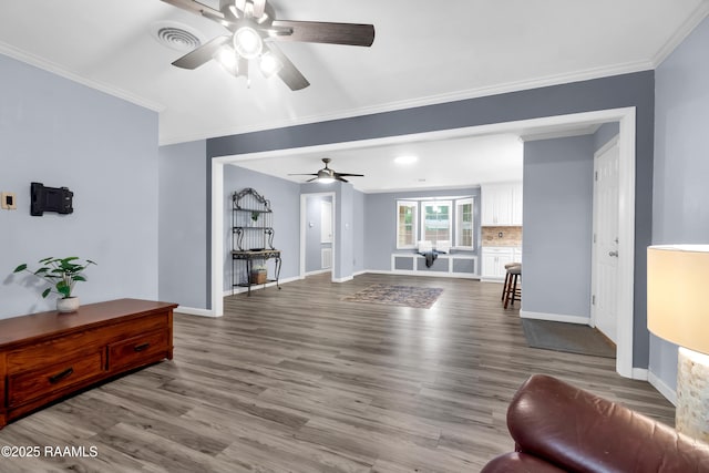 177 Radcliffe Dr, Lafayette, LA 70501 - living room with a ceiling fan, wood finished floors, and crown molding