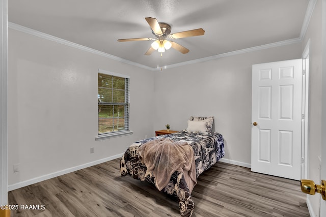 177 Radcliffe Dr, Lafayette, LA 70501 - bedroom with wood finished floors, ornamental molding, and a ceiling fan