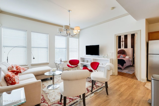 201 Settlers Trace Blvd Unit 4404, Lafayette, LA 70508 - living room featuring a chandelier, ornamental molding, and light wood-style floors