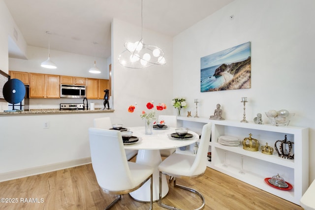 201 Settlers Trace Blvd Unit 4404, Lafayette, LA 70508 - dining room featuring wood finished floors and a chandelier