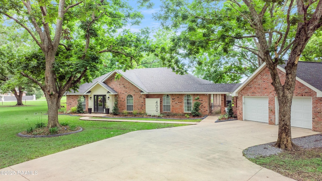 400 E Fairfield Dr, Broussard, LA 70518 - ranch-style house featuring brick siding, driveway, a front yard, a shingled roof, and a garage