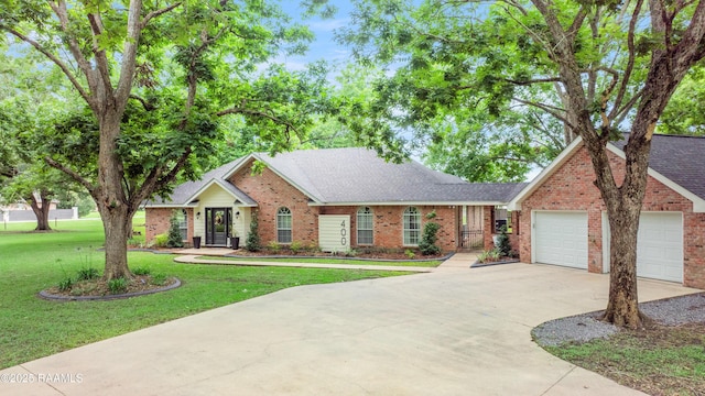 400 E Fairfield Dr, Broussard, LA 70518 - ranch-style house featuring brick siding, driveway, a front yard, a shingled roof, and a garage