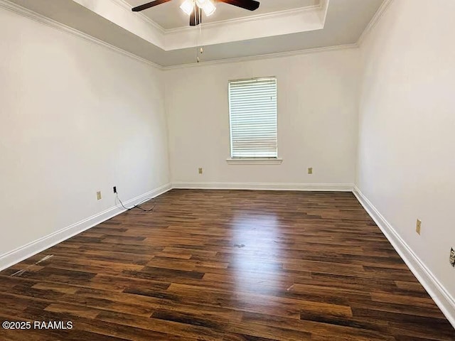 1108 Poydras Pl, Breaux Bridge, LA 70517 - unfurnished room featuring a tray ceiling, ceiling fan, dark wood finished floors, and ornamental molding