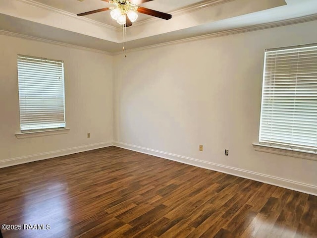 1108 Poydras Pl, Breaux Bridge, LA 70517 - unfurnished room featuring a raised ceiling, dark wood-style flooring, ceiling fan, crown molding, and plenty of natural light