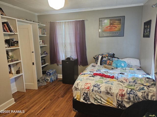 118 Pollard Ave, New Iberia, LA 70563 - bedroom with crown molding and wood finished floors