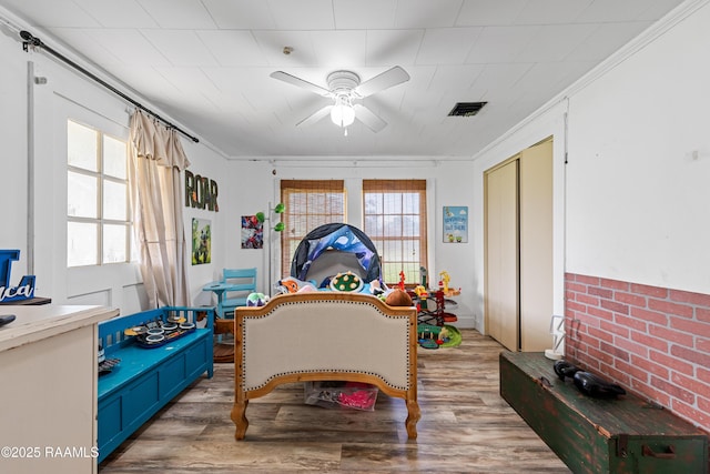 1054 Main St, Parks, LA 70582 - sitting room with ceiling fan, wood finished floors, and ornamental molding