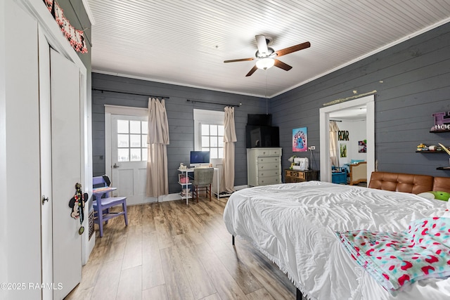 1054 Main St, Parks, LA 70582 - bedroom featuring wood finished floors, a desk, wooden walls, and ceiling fan