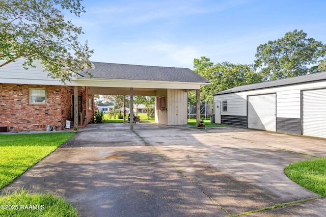 1054 Main St, Parks, LA 70582 - surrounding community with driveway, an outbuilding, a carport, and a lawn