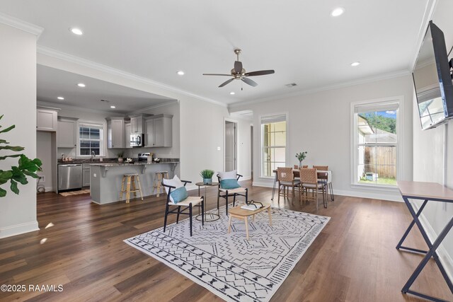 119 Alpine Dr, Lafayette, LA 70506 - dining space with dark wood finished floors, recessed lighting, ceiling fan, and ornamental molding