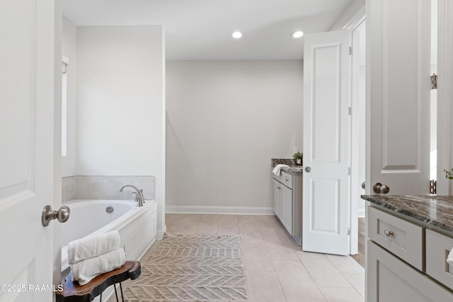 119 Alpine Dr, Lafayette, LA 70506 - full bathroom featuring vanity, a garden tub, recessed lighting, and tile patterned flooring